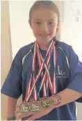  ??  ?? Halton Swimming Club’s Cerys Neil won her first medals at the Prescot & Everton Spring Gala.