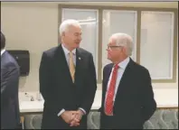  ?? The Sentinel-Record/Richard Rasmussen ?? ANTHONY FAMILY: Gov. Asa Hutchinson, left, talks with John Ed Anthony at the grand opening of the new CHI St. Vincent Hot Springs Anthony Childbirth Center on Monday. Anthony attended as a representa­tive of the Catherine Cooper Anthony Charitable Trust.