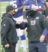  ?? JOHN MINCHILLO — THE ASSOCIATED PRESS ?? Washington Football Team’s Ron Rivera, left, talks to New York Giants’ Joe Judge, right, after an NFL football game Sunday.