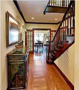  ??  ?? The entry has original hardwood floors.