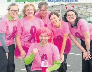  ??  ?? ●●Staff at the Asda superstore in Rochdale are raising money for breast cancer charities