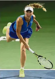  ?? — AP ?? A tough customer: Caroline Wozniacki beat Kateryna Bondarenko 3- 6, 6-2, 6-3 for a quarterfin­al date with Bellis.