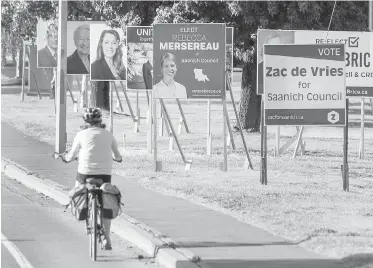  ??  ?? Municipal election signs in Saanich. A letter-writer says she prefers to vote for first-time candidates.