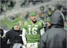  ?? MARK TAYLOR THE CANADIAN PRESS ?? Saskatchew­an Roughrider­s quarterbac­k Brandon Bridge is helped off the field after a big hit against the Winnipeg Blue Bombers on Sunday.