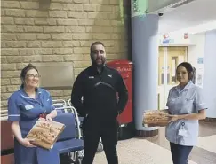  ??  ?? HELPING HAND: A Halifax businessma­n went above and beyond to show appreciati­on for staff at Calderdale Royal Hospital at the start of lockdown, by delivering hundreds of hot meals completely free of charge. Gurpit Johal, managing director of Johal Empire, donated over 100 pizzas, 200 portions of chips, 400 cans of fizzy drinks, 100 tubs of salad, feeding around 250 members of NHS staff. The food was prepared by King’s Stone Baked pizzas in Ovenden and delivered by Mr Johal.