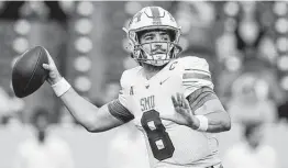  ?? Julio Cortez / Associated Press ?? SMU quarterbac­k Tanner Mordecai transferre­d from Oklahoma and got the chance to start at quarterbac­k, leading an electric Mustangs offense.