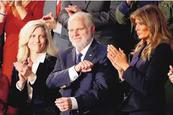  ?? PATRICK SEMANSKY/ASSOCIATED PRESS ?? Rush Limbaugh’s wife, Kathryn, left, and first lady Melania Trump applaud during President Donald Trump’s State of the Union address Feb. 4, 2020, a day after Limbaugh announced his cancer diagnosis.