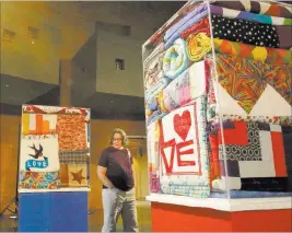  ??  ?? Jeanne Spala checks out the Oct. 1 quilt exhibit, which will be displayed at the Clark County Government Center through July 20.