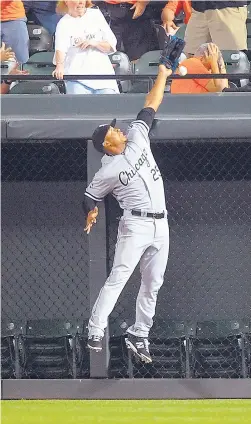  ?? | MITCHELL LAYTON/GETTY IMAGES ?? White Sox right fielder Moises Sierra cannot come up with Nelson Cruz’s grand slam in the eighth inning that tied the game at 4.