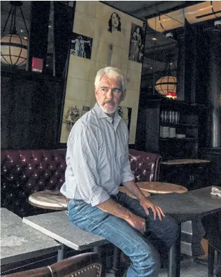  ?? Cody O’Loughlin, © The New York Times Co. ?? Restaurate­ur Garrett Harker sits in the dining room of Eastern Standard, his popular restaurant in Boston that has remained closed since March. Months of pandemic- related closures have left many business owners too deeply in debt to survive without concession­s or deferrals from their landlords.