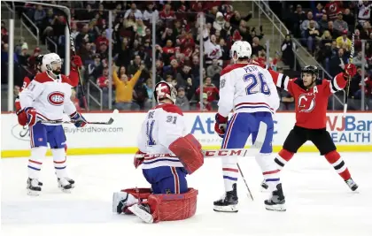  ?? JULIO CORTEZ/THE ASSOCIATED PRESS ?? The Canadiens’ defence couldn’t find its gear Wednesday against the Devils, who put five goals past Carey Price.