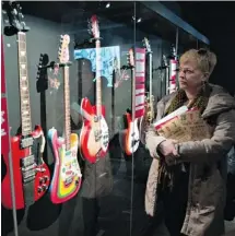  ?? RYAN REMIORZ/THE CANADIAN PRESS ?? A collection of period guitars is on display at the Beatles exhibit.