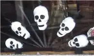  ?? (Special to the Democrat-Gazette/Marcia Schnedler) ?? A spread of skulls is displayed in a window at the Royal Theater in Benton.