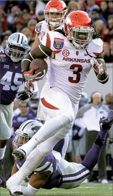  ?? Arkansas Democrat-Gazette/BENJAMIN KRAIN ?? Arkansas running back Alex Collins ran for 185 yards and 3 touchdowns during Saturday’s 45-23 Liberty Bowl victory over Kansas State at Liberty Bowl Memorial Stadium in Memphis. More photos are available at arkansason­line.com/galleries.