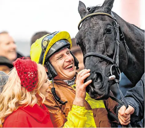  ?? ?? Jockey Paul Townend celebrates with owner Audrey Turley after winning the Cheltenham Gold Cup Chase with Galopin Des Champs. Photos: Harry Murphy/Sportsfile