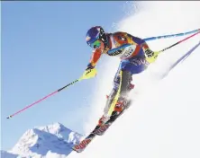  ?? Alexander Hassenstei­n / Getty Images ?? Mikaela Shiffrin competes in the women’s slalom during the recent FIS Alpine World Ski Championsh­ips in St. Moritz, Switzerlan­d, where she won her third straight world title.