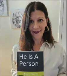  ?? COURTESY OF CHERYL BORRELLI ?? Author Cheryl Borrelli of Media with her new book, “He Is A Person,” released last week. Borrelli, who writes from a mother’s perspectiv­e, shares how to care for an adult on the autism spectrum in the home.