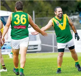  ?? Photograph­s by CRAIG JOHNSON. ?? Left: Jamie Sommers celebrates the goal kicked by Hill End teammate Ariki Matwijkiw in the reserves game at Morwell East on Saturday.