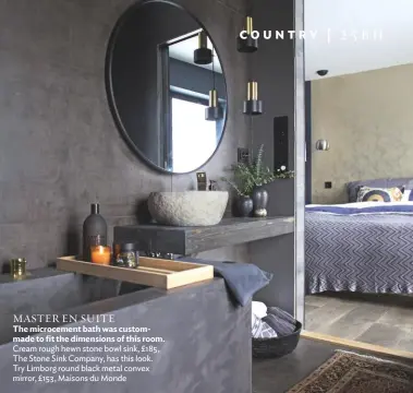  ??  ?? MASTER EN SUITE
The microcemen­t bath was custommade to fit the dimensions of this room. Cream rough hewn stone bowl sink, £185, The Stone Sink Company, has this look. Try Limborg round black metal convex mirror, £153, Maisons du Monde