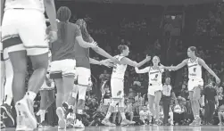  ?? PATRICK BREEN/THE REPUBLIC ?? Mercury guards Diana Taurasi, left, and Skylar Diggins-Smith (4) celebrate with forward Sophie Cunningham after a Liberty timeout on Thursday night at Footprint Center in Phoenix.