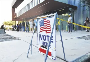  ?? PHOTO BY CESAR NEYOY/BAJO EL SOL ?? VOTERS LINE UP AT A VOTING CENTER in Somerton during Tuesday’s general election.