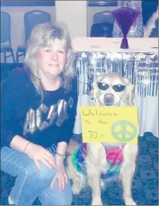  ?? BILL VON DRASEK ?? Waylon poses with owner Debbie Tomasik at a 1970s-themed fundraiser for PAWS Tinley Park. Waylon helped collect donations for area nonprofits.