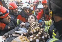  ?? CAN OZER AP ?? Rescuers carry Muhammed Alkanaas, 12, to an ambulance Saturday after they pulled him out of the rubble in Antakya, southern Turkey.