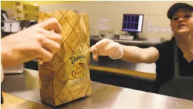  ?? Charles Krupa / Associated Press 2010 ?? Panera is counting on technology to help get special orders right, using color codes to underscore the importance of added or omitted ingredient­s.