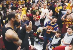  ?? Associated Press photo ?? Cleveland Cavaliers' LeBron James blows kisses as he walks off the floor after a 12893 victory over the Toronto Raptors in Game 4 of an NBA basketball second-round playoff series, Monday.