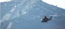  ?? STAFF SGT. JEFFREY ANDERSON III, MARINE CORPS ?? A Marine helicopter delivers aid and relief supplies to remote areas of quake-ravaged Nepal on Sunday.