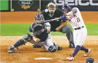  ?? SUE OGROCKI/ASSOCIATED PRESS ?? The Astros’ Jose Altuve hits a two-run walk-off homer to win Game 6 of the American League Championsh­ip Series against the Yankees on Saturday in Houston.