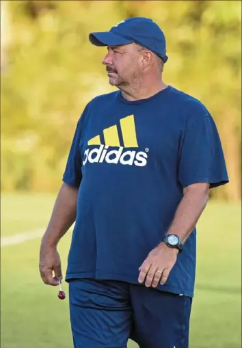  ?? Christian Snyder/Post-Gazette ?? Bill Pfeifer, pictured coaching a game for Hopewell in 2019, is returning to Moon, where he coached for 17 years and won three WPIAL titles.