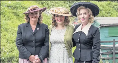  ??  ?? Pictured are three women in glamorous outfits as part of last year’s 1940s Wartime Weekend at Great Central Railway. Picture courtesy of Colin Barsby.