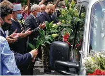  ?? Darko Bandic / Associated Press ?? Dignitarie­s on Friday pay respect to the remains of 19 victims of the Srebrenica massacre for reburial scheduled for Sunday.