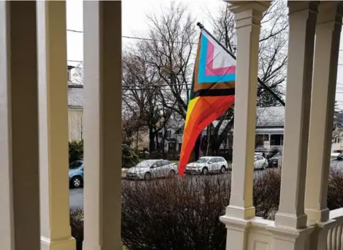  ?? PHOTOS BY CHERYL SENTER FOR THE BOSTON GLOBE ?? A progress pride flag (above) was displayed outside Unity House in Keene, N.H., which welcomed its first residents last Tuesday. It’s the first group home in the state catering to at-risk teenagers who identify as part of the LGBTQ community.