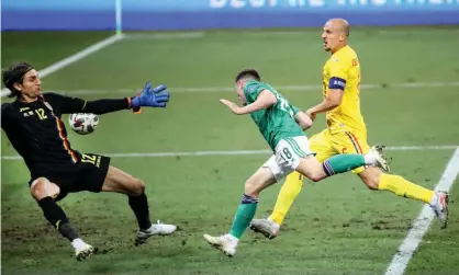  ?? Photograph: Presseye/INPHO/Shuttersto­ck ?? Gavin Whyte heads home late in the game to give Northern Ireland a 1-1 draw against Romania in the Nations League.