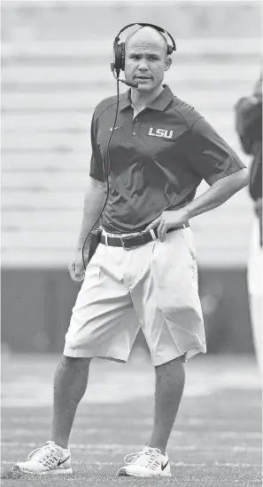  ?? MATT BUSH/USA TODAY SPORTS ?? LSU defensive coordinato­r Dave Aranda is one of 21 assistant football coaches who make $1 million or more, according to the latest USA TODAY college coaching salary survey.