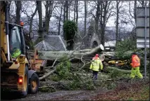  ??  ?? Havoc: Clearing trees from the road near Culloden