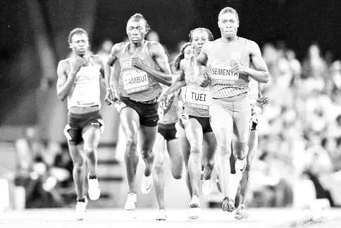  ?? — AFP photo ?? South Africa’s Caster Semenya (R) competes in the athletics women’s 800m final during the 2018 Gold Coast Commonweal­th Games at the Carrara Stadium on the Gold Coast on April 13, 2018.