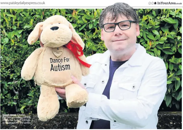  ??  ?? Good cause Charles Docherty is raffling off the Dance for Autism soft toy to raise cash for the centre