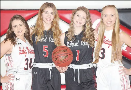  ?? RICK PECK/ SPECIAL TO MCDONALD COUNTY PRESS ?? Senior members of the 2020-21 McDonald County High School girls’ basketball team. From left to right: Laney Wilson, Sydney Killion, Caitlyn Barton and Kristin Penn.