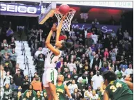  ?? Christian Abraham / Hearst Connecticu­t Media ?? Norwalk’s Naeva Rene scores the winning basket to beat New London in Saturday’s Class LL title game.