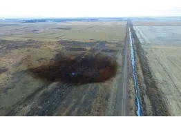  ?? DroneBase via AP ?? This aerial photo shows spills from TransCanad­a Corp.’s Keystone pipeline on Friday, which leaked an estimated 210,000 gallons of oil onto agricultur­al land in northeaste­rn South Dakota, near Amherst, S.D., the company and state regulators said...