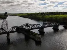 ?? Will Waldron / Times Union ?? The Livingston Avenue railroad bridge linking Albany and Rensselaer is viewed from the air on Friday in Albany.