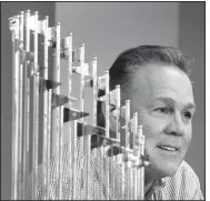  ?? AP File Photo ?? Kansas City Royals manager Ned Yost speaks to members of the media alongside the Royals’ World Series trophy during a news conference wrapping up the team’s season on Nov. 5, 2015. Yost will be retiring at the end of the season.