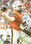  ?? ERIC ESPADA/GETTY ?? Tyler Van Dyke throws a touchdown pass during the second quarter Saturday against North Carolina at Hard Rock Stadium in Miami Gardens.