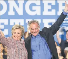  ??  ?? File photo shows Clinton and Kaine waving during a campaign rally at Ernst Community Cultural Centre in Annandale, Virginia. — AFP photo