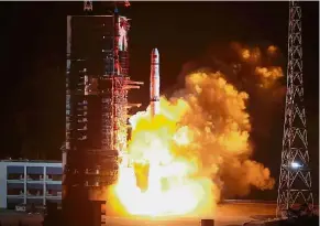  ?? — AFP ?? Liftoff: A Long March-4C rocket taking off from the Xichang launch centre carrying the Queqiao (‘Magpie Bridge’) satellite.