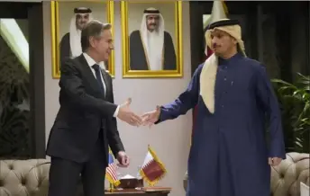  ?? Mark Schiefelbe­in/Associated Press ?? Secretary of State Antony Blinken, left, shakes hands with Qatar’s Prime Minister and Foreign Affairs Minister Sheikh Mohammed bin Abdurrahma­n Al Thani on Tuesday at Diwan Annex, in Doha, Qatar.