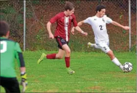  ?? BOB RAINES — DIGITAL FIRST MEDIA ?? La Salle’s Joe Brigidi takes a shot from the corner past St. Joseph’s Prep’s Liam Broderick during their PCL semifinal Wednesday.